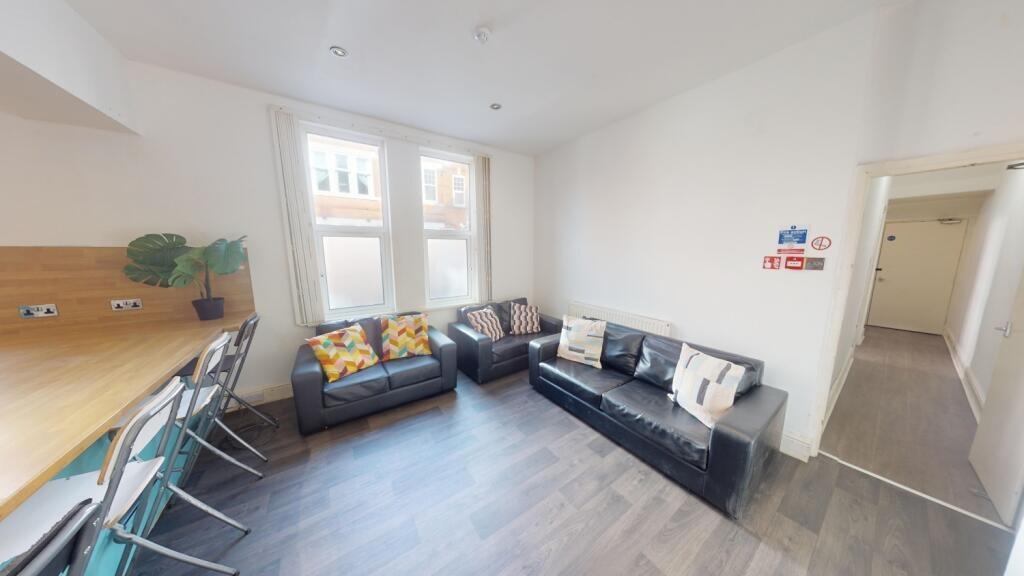 Bright and contemporary living room featuring c...