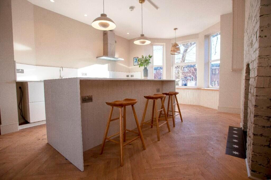 A modern and spacious kitchen with ample natura...