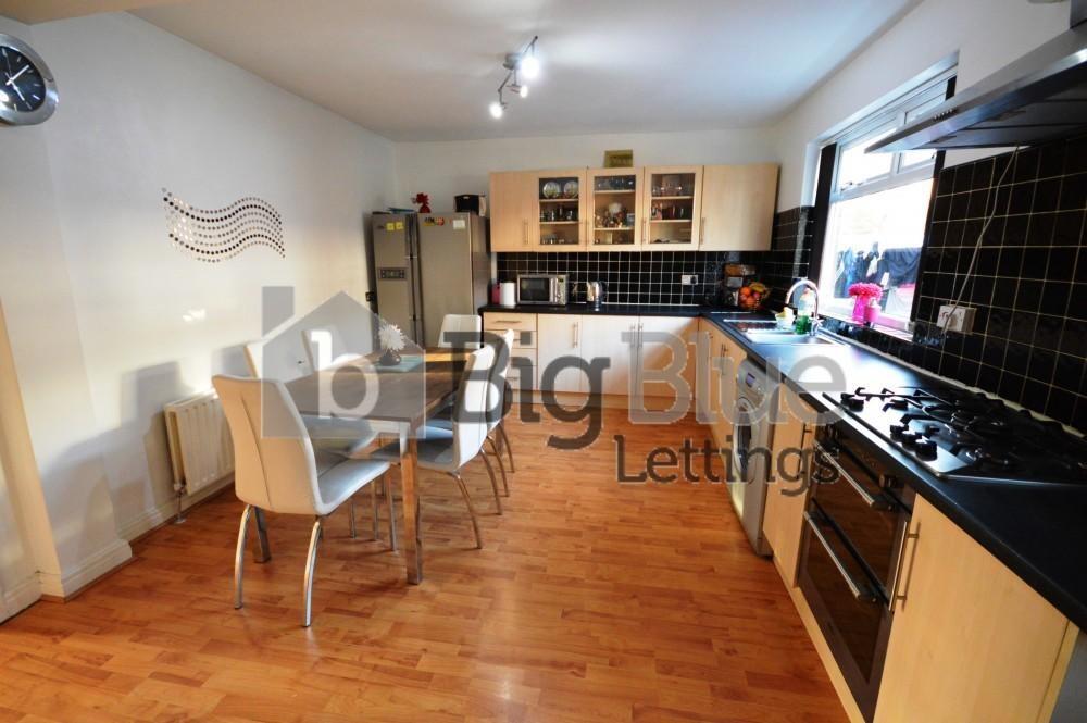 Bright and modern kitchen with ample counter sp...