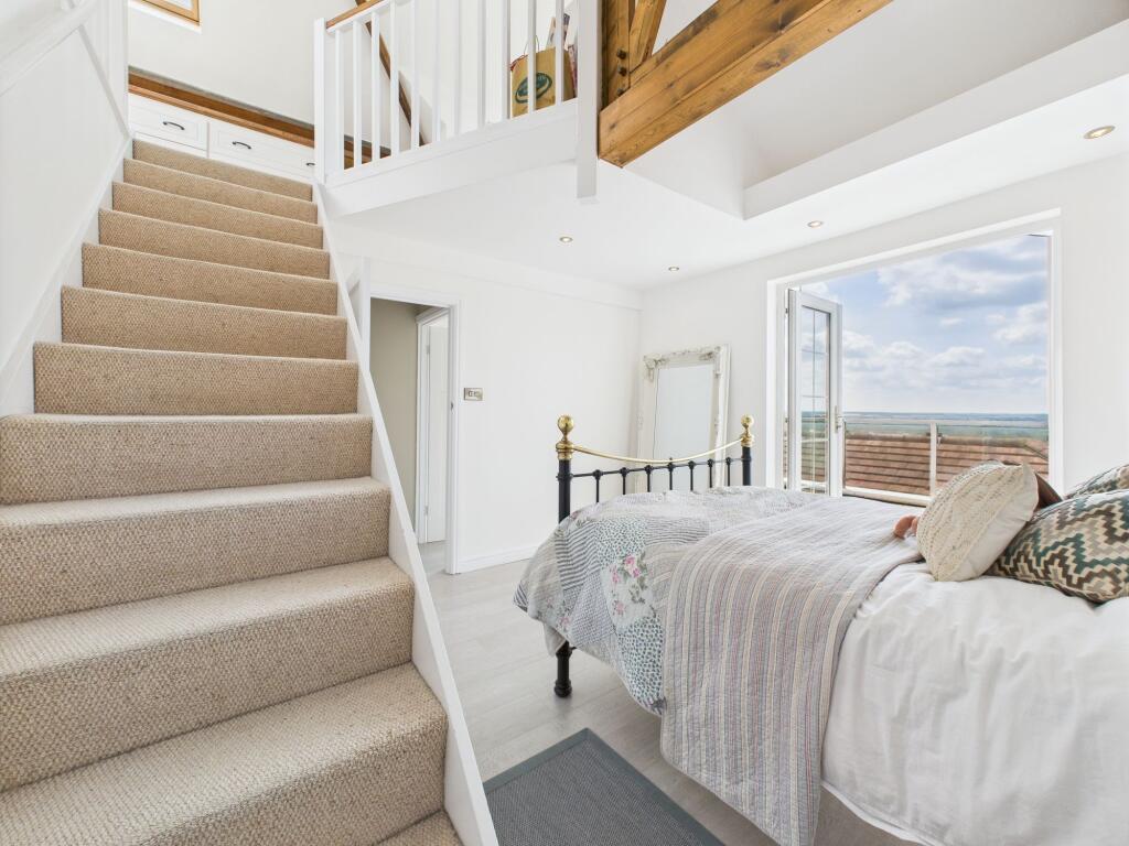 Stairs from Bedroom One to Mezzanine Level