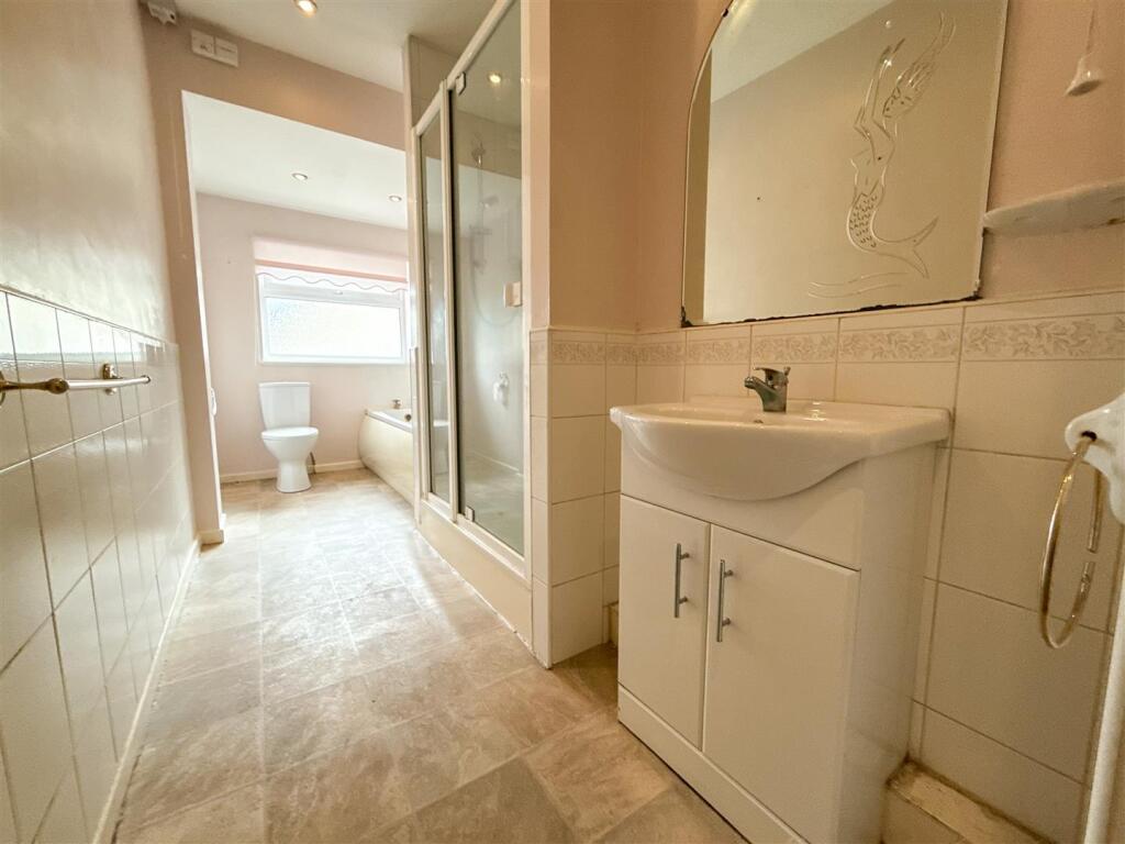 FAMILY BATH AND SHOWER ROOM
