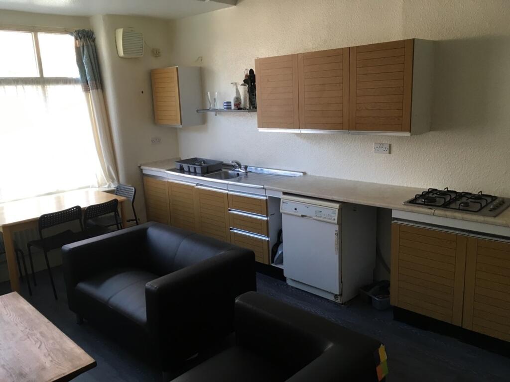 Spacious kitchen featuring ample cabinetry and ...