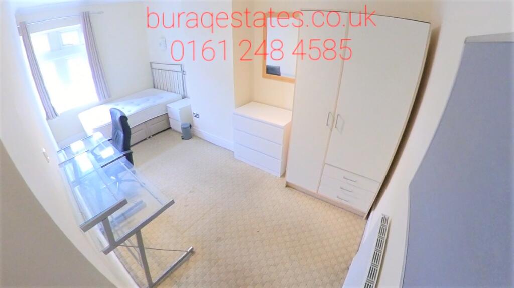 Bright and clean small room featuring a wardrob...