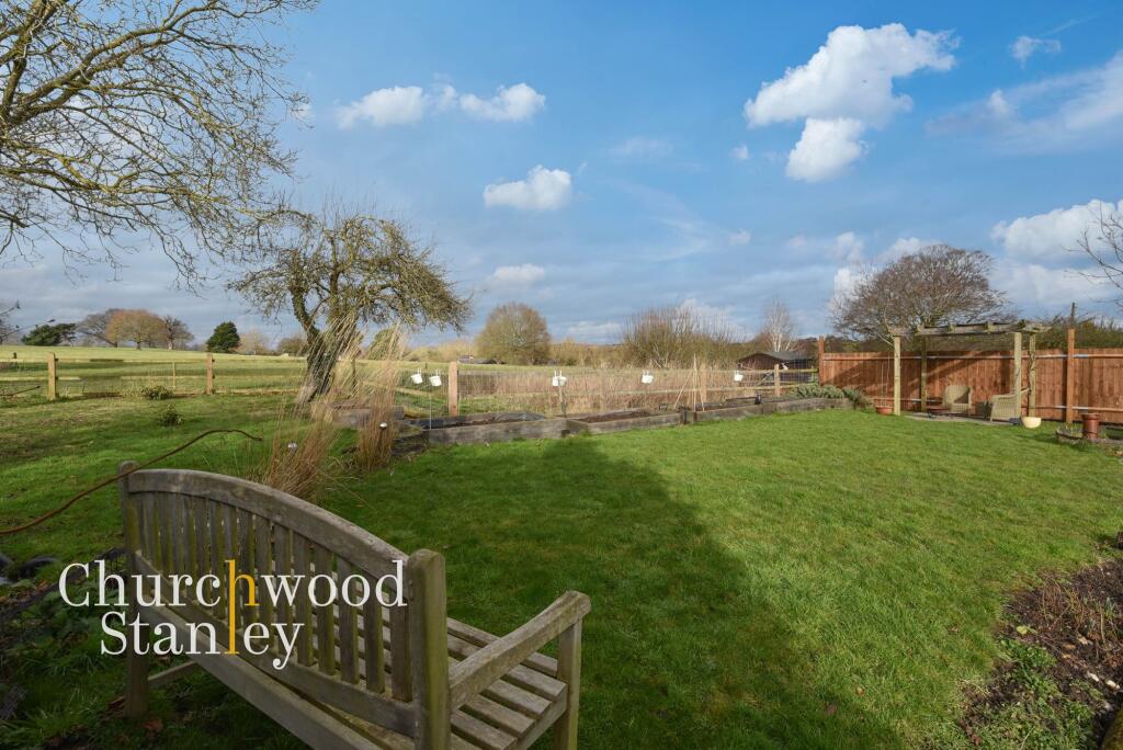 Rear garden and farmland beyond