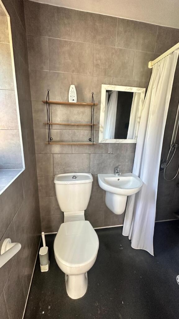A clean and functional bathroom featuring a toi...