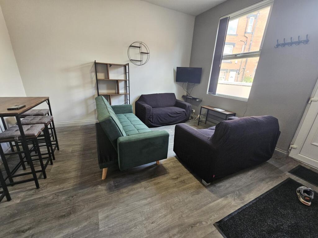 A modern and inviting living room with ample se...