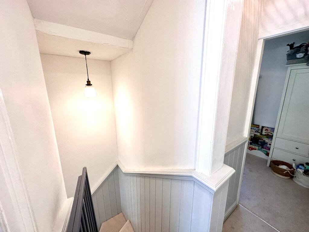 TO THE FIRST FLOOR LANDING