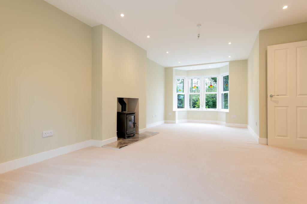 Light and spacious lounge with log burner