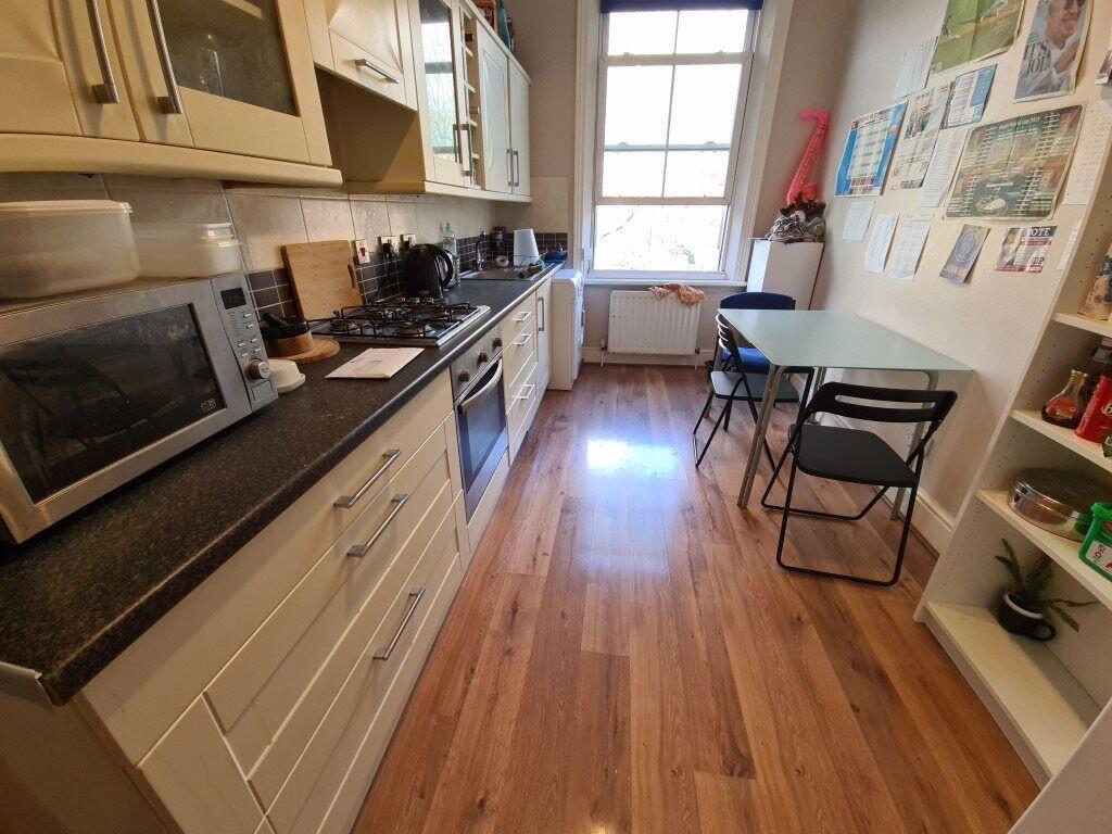 A bright and well-maintained kitchen featuring ...