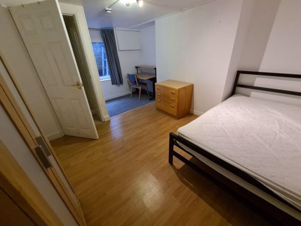 A tidy, well-maintained double bedroom featurin...