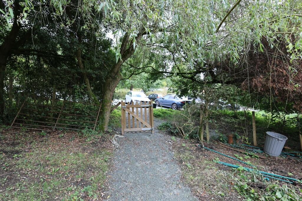GATE TO PARKING SPACES