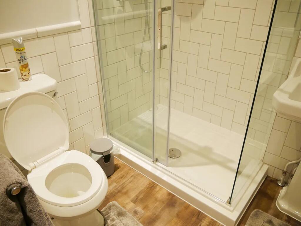 A stylish bathroom suite featuring a modern wal...