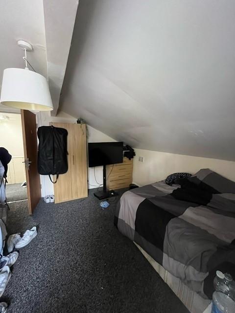 Cozy attic double bedroom with sloped ceiling, ...