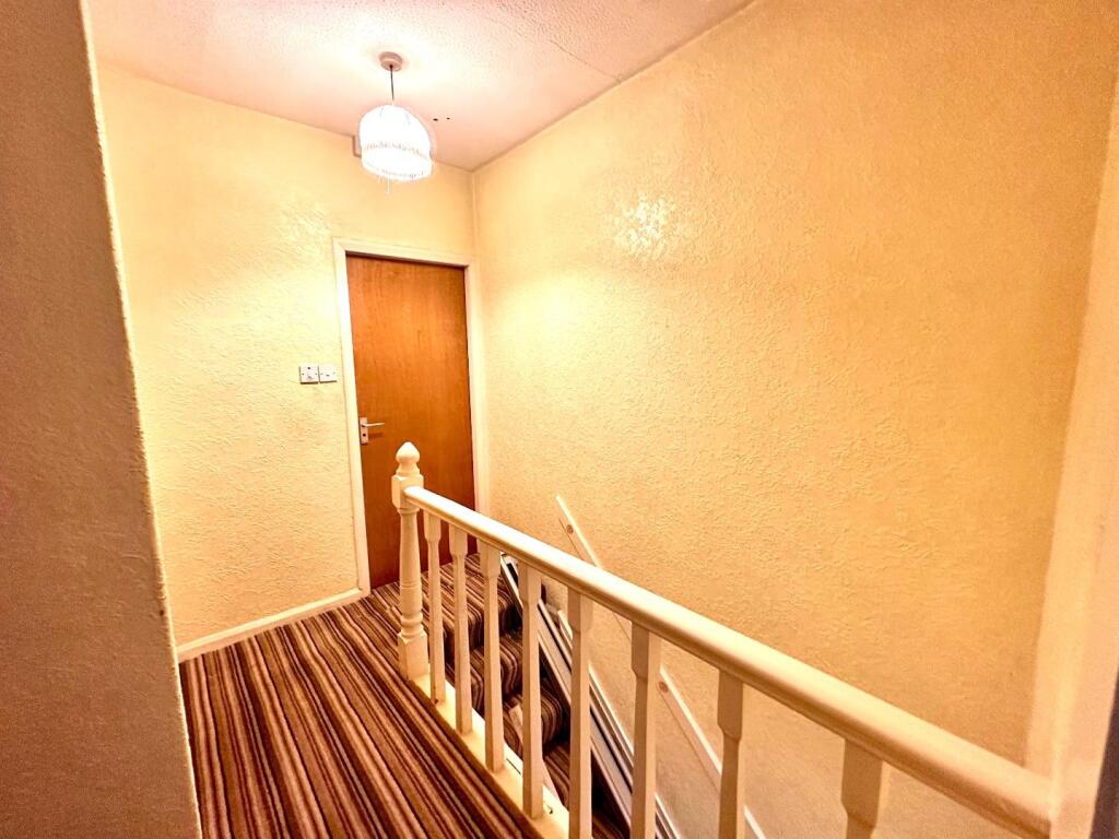 TO THE FIRST FLOOR LANDING