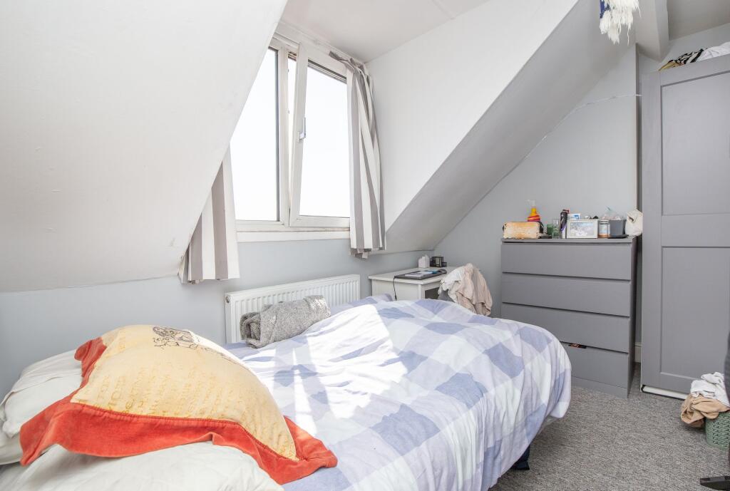Bright and cozy double bedroom featuring a larg...