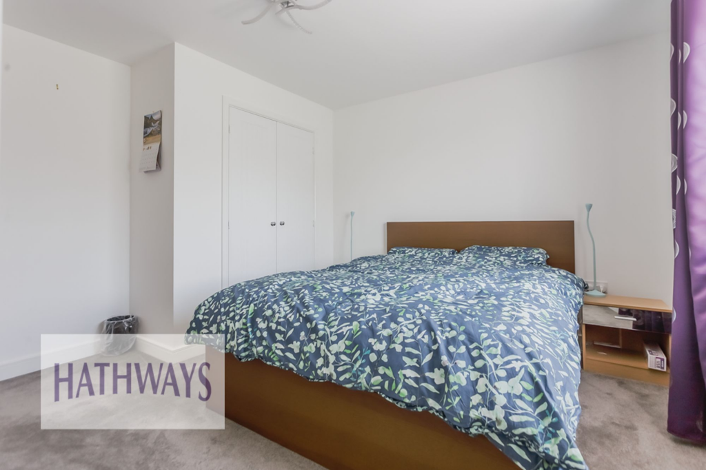 Master bedroom with a built-in wardrobe