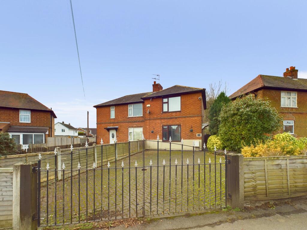 Front with Gates and Driveway
