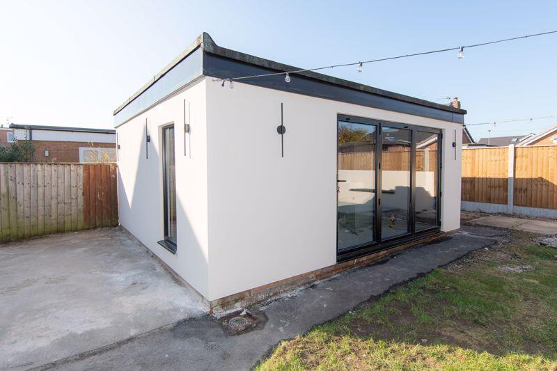 Versatile outbuilding with bi-fold door