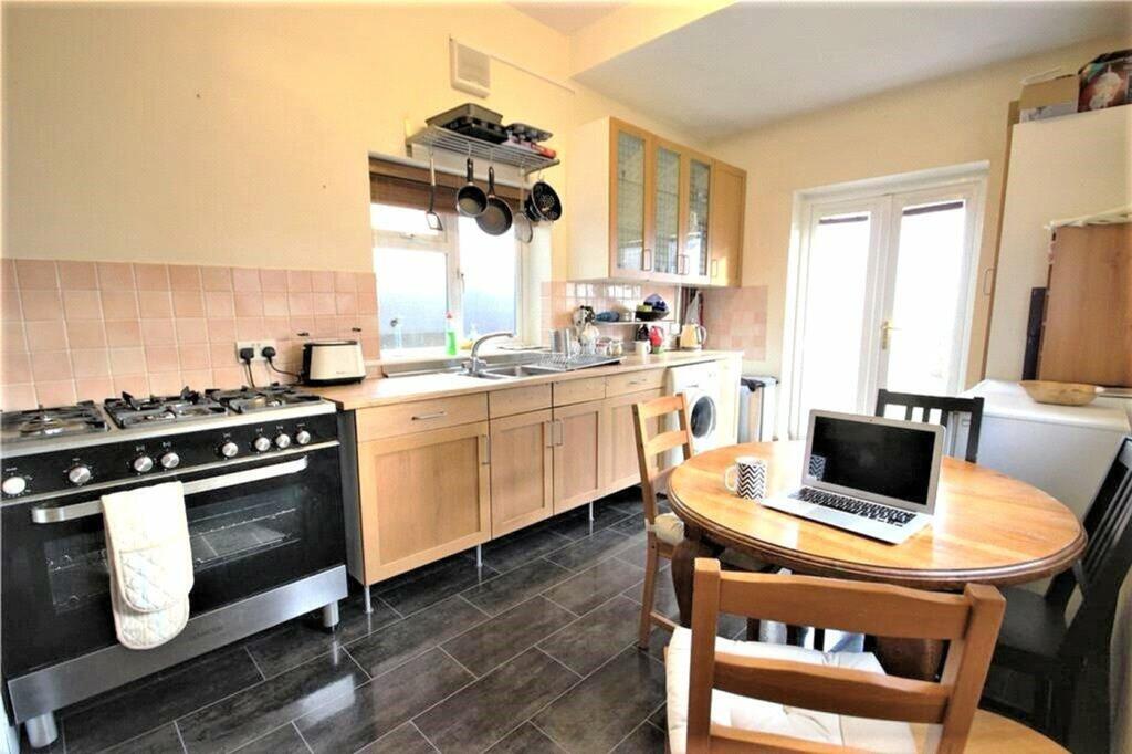 Bright and spacious kitchen featuring modern ap...