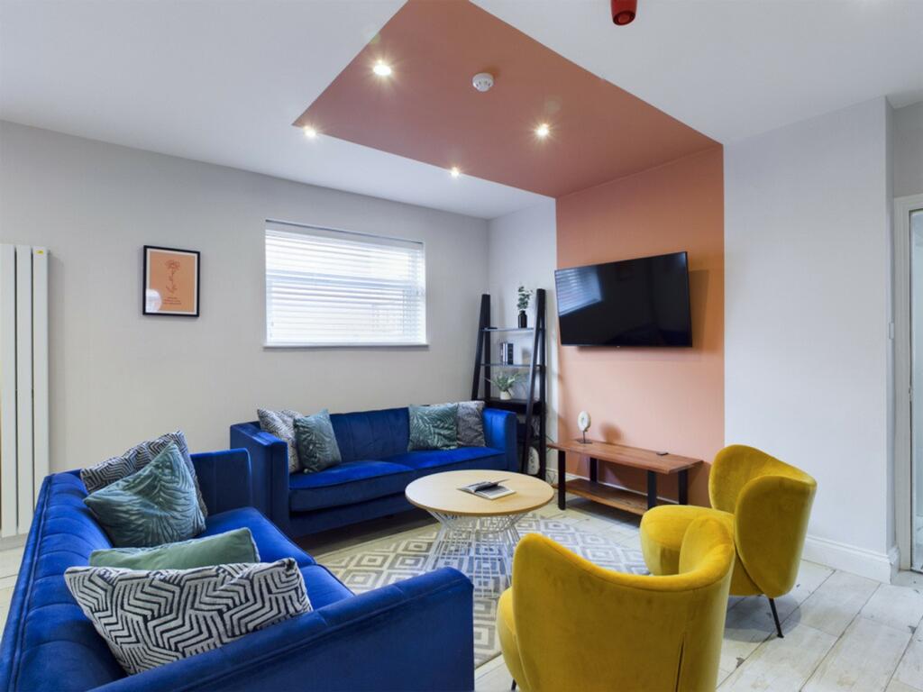 A stylish and spacious modern living room, perf...