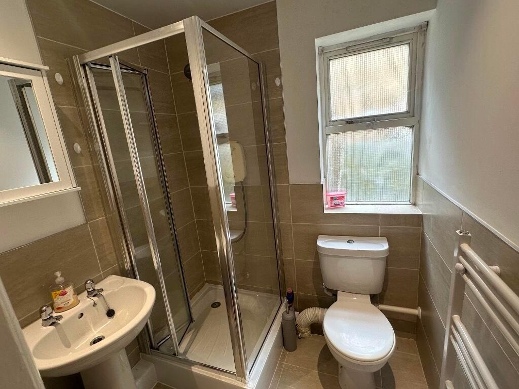 A neat and well-maintained bathroom featuring a...