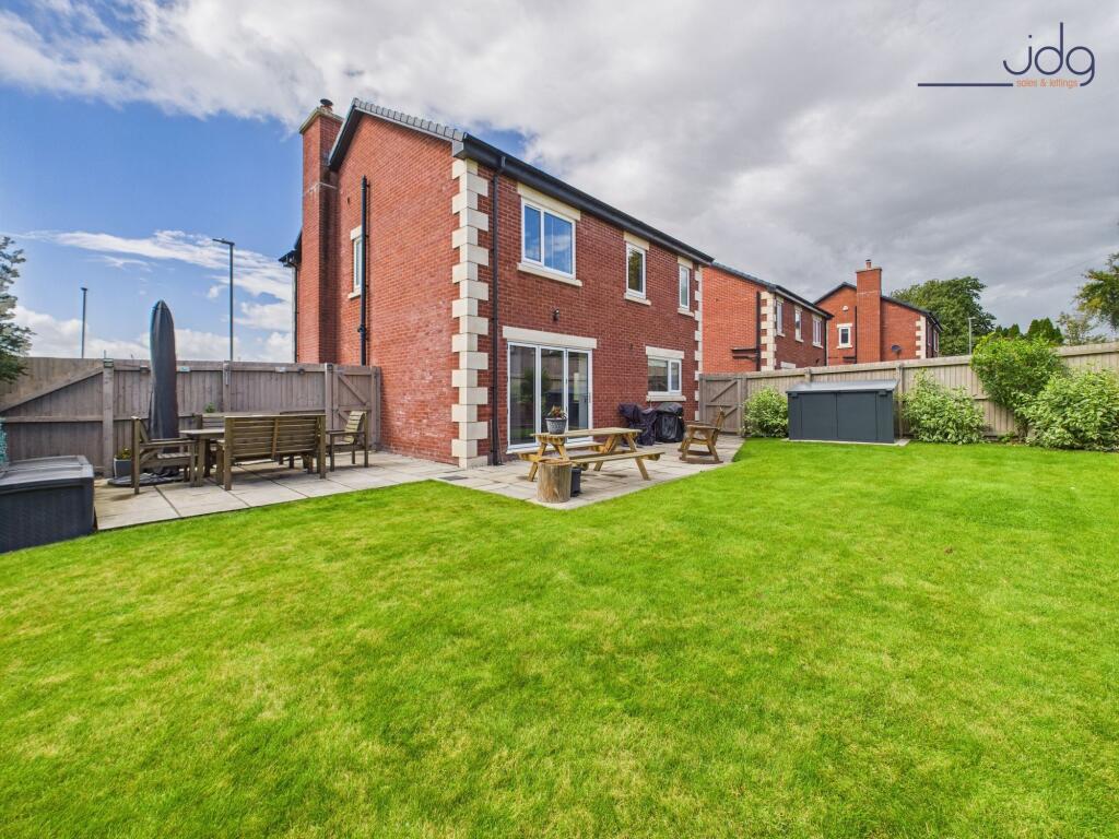 Rear view of the property and garden