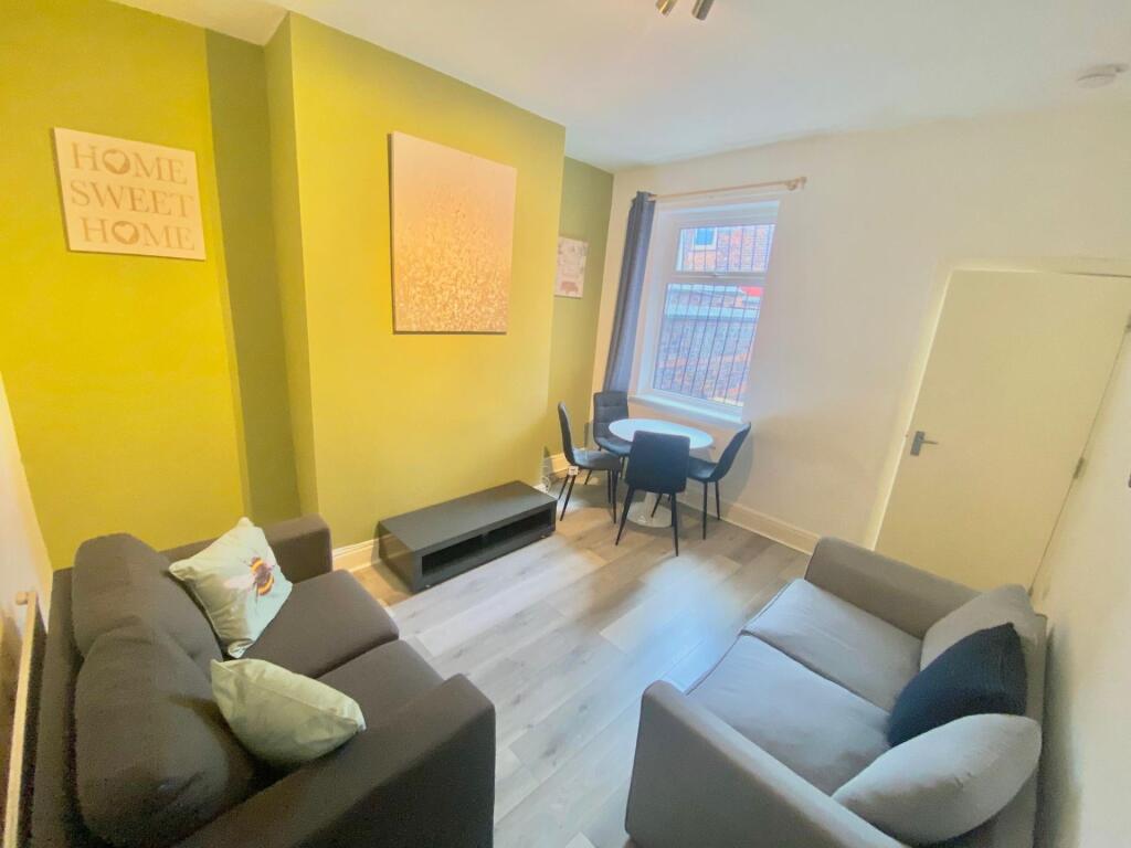 A cozy and modern living room featuring comfort...