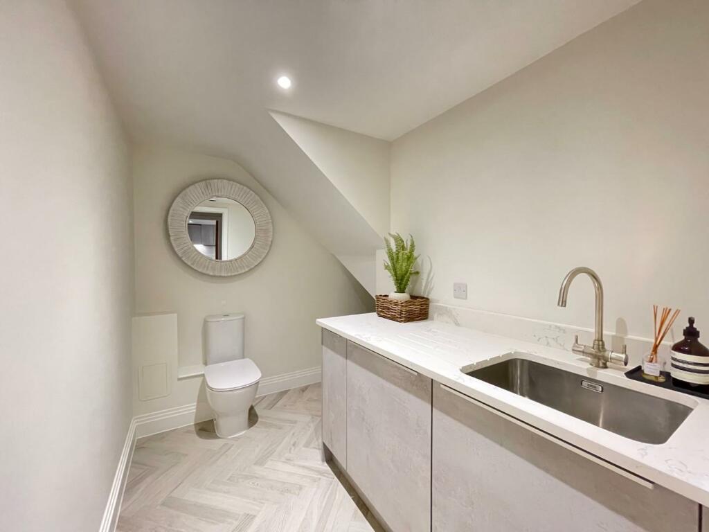 CLOAKROOM/UTILITY ROOM