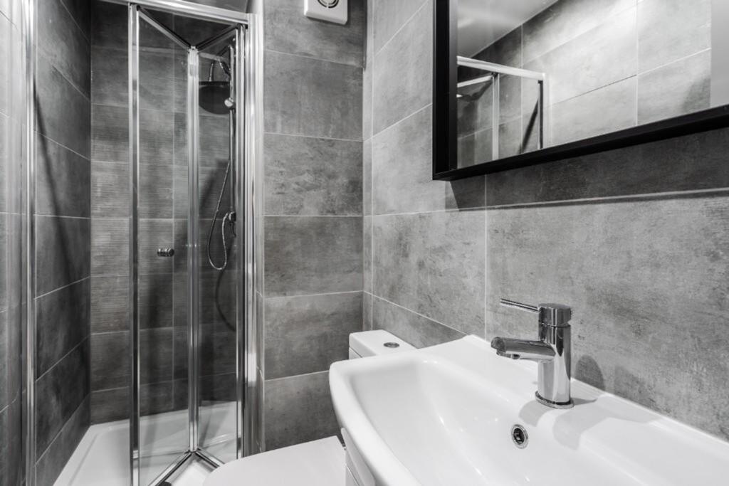 A modern and clean bathroom featuring a stylish...