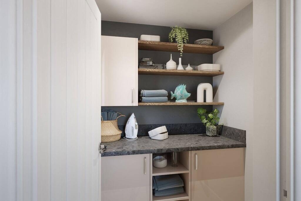 A utility room can be found off the kitchen