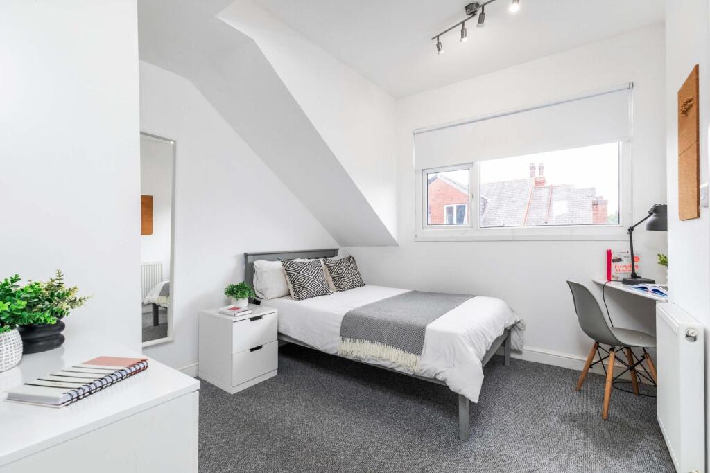 Bright and spacious master bedroom featuring a ...