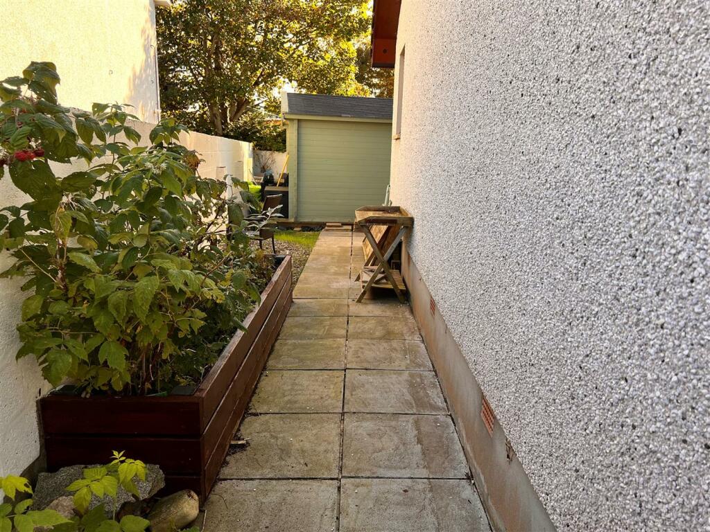 Side of property with raised beds.jpg