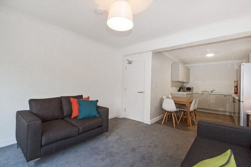 A cozy and well-maintained living room featurin...