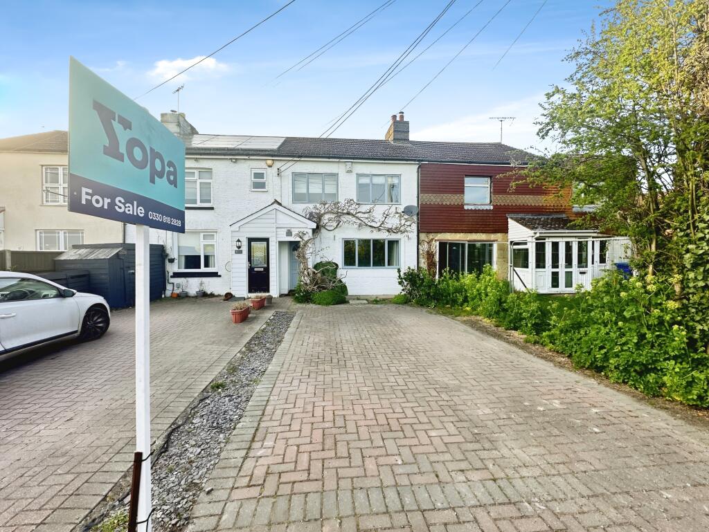 Front View Of The Property With Driveway Parking