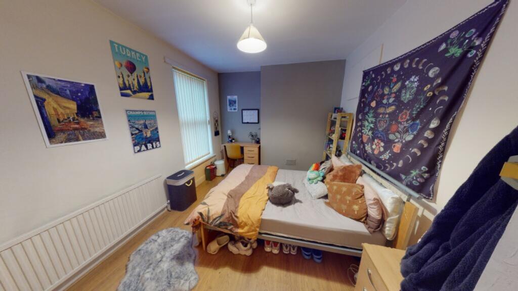 A cozy and well-decorated double bedroom, perfe...