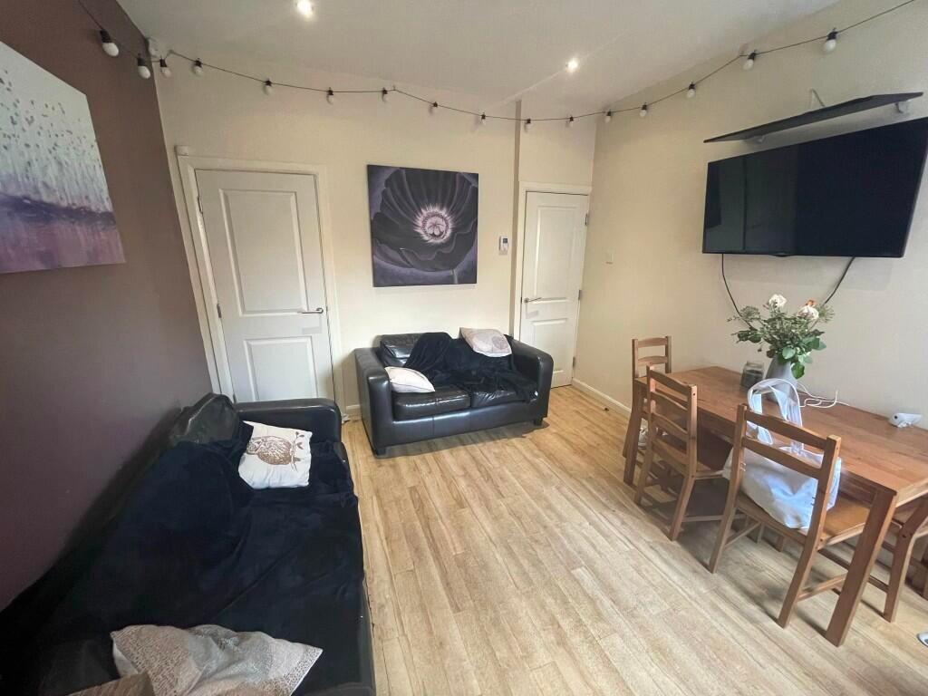 A cozy living room featuring comfortable black ...