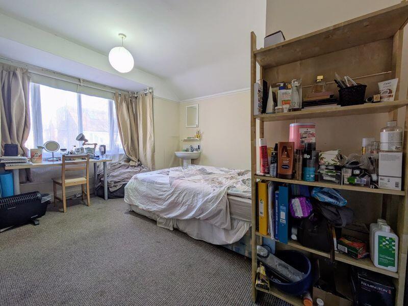 Bright and spacious master bedroom featuring a ...