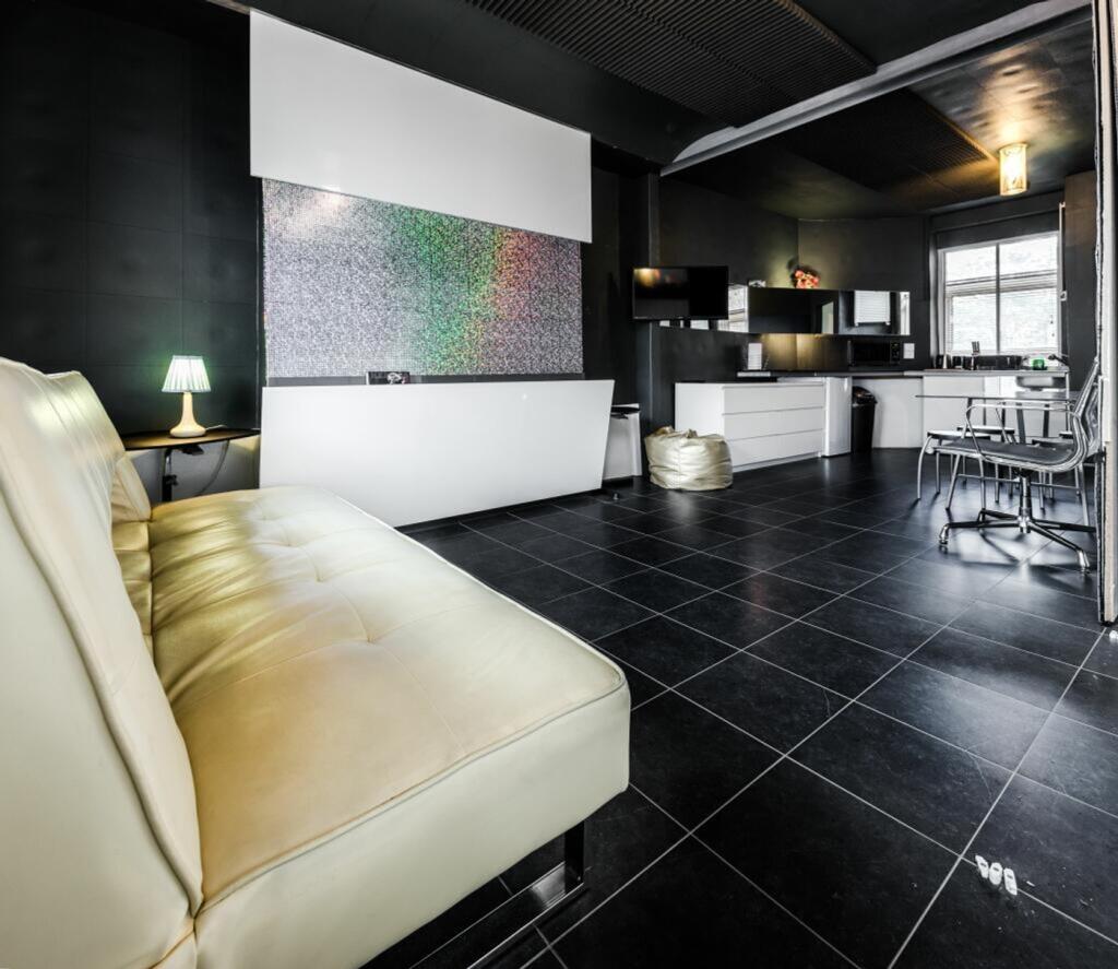 A stylish living room with modern decor and amp...