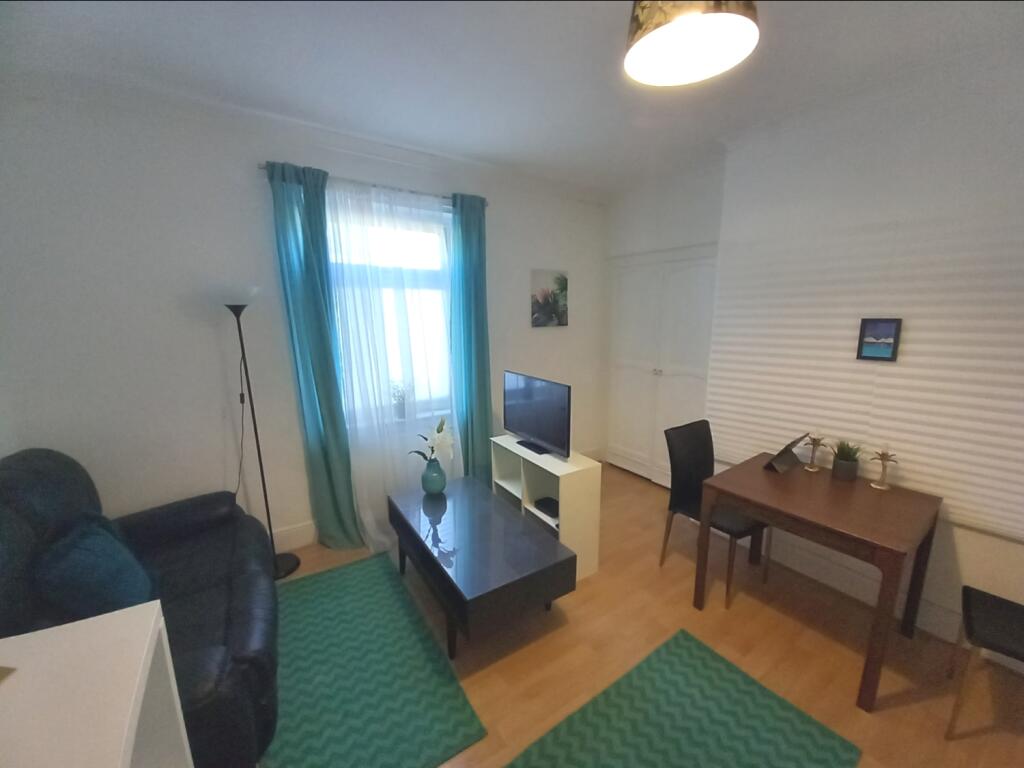 FIRST FLOOR APARTMENT LOUNGE AND BEDROOM