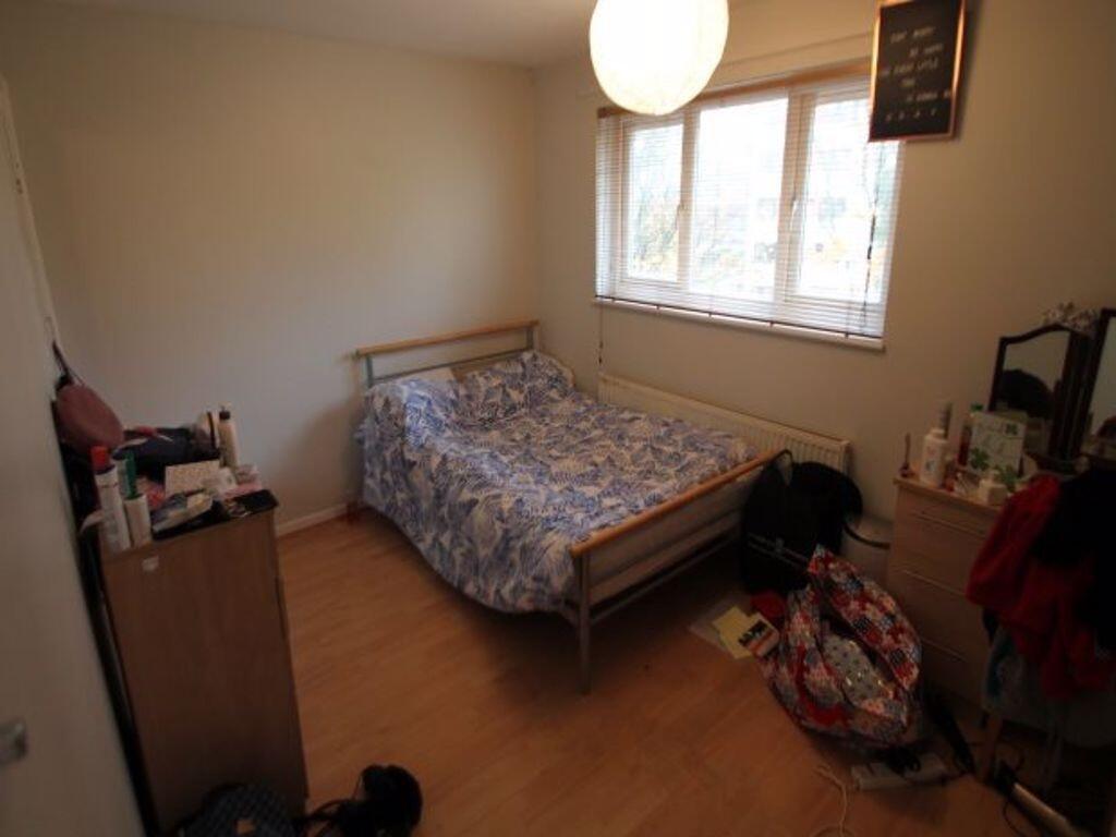 Cozy furnished bedroom with a single bed, woode...