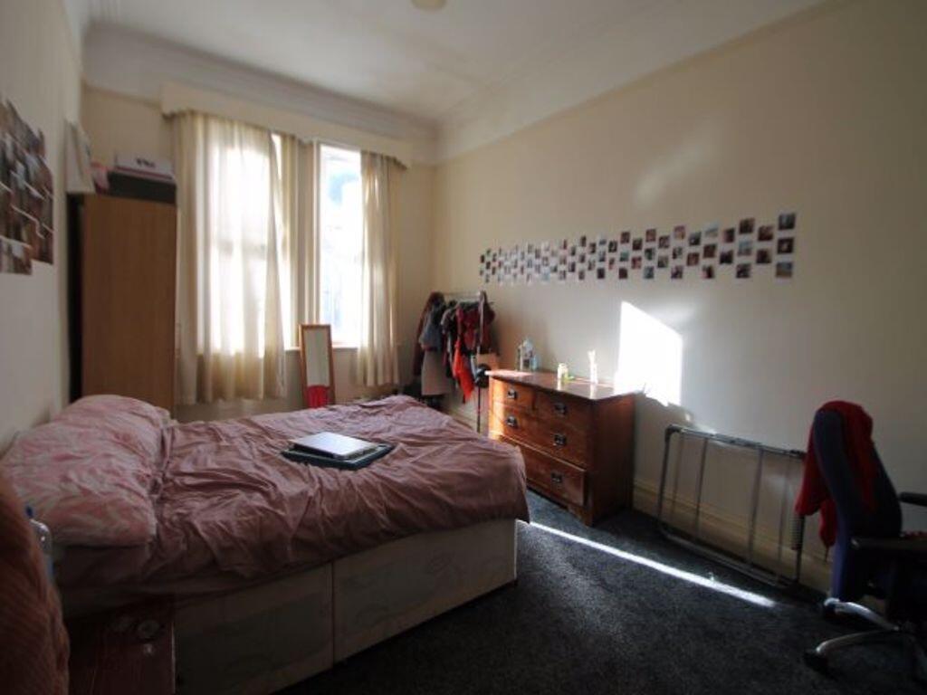 A cozy double bedroom featuring a comfortable d...