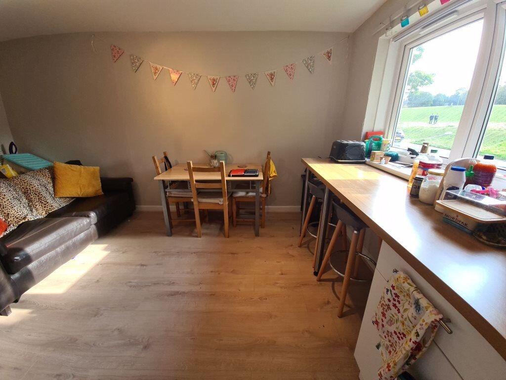 A bright and inviting living room featuring lar...