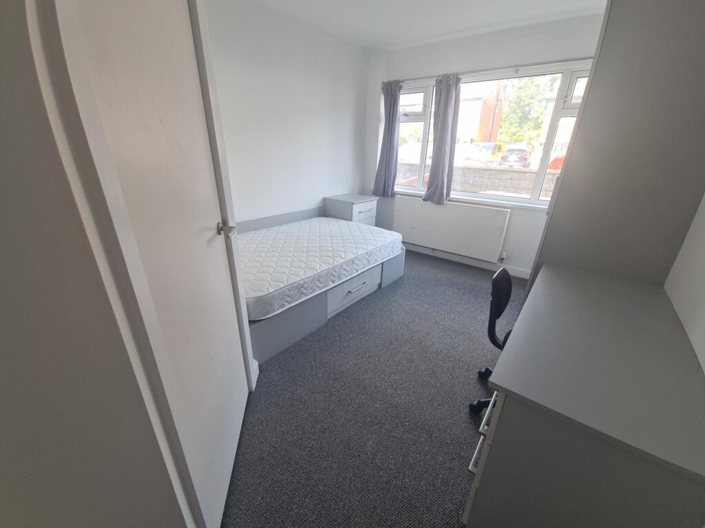 A clean and bright single toilet room with a wh...