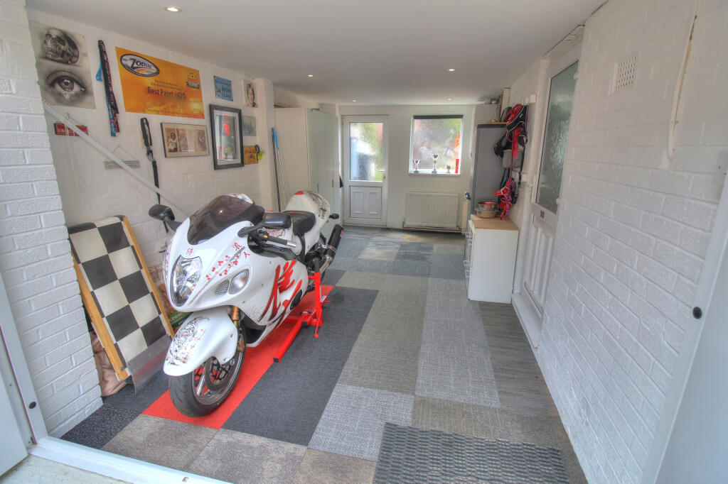 Garage with bi folding doors