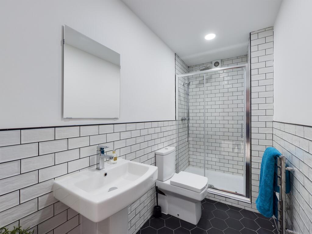 A modern and stylish bathroom featuring sleek t...