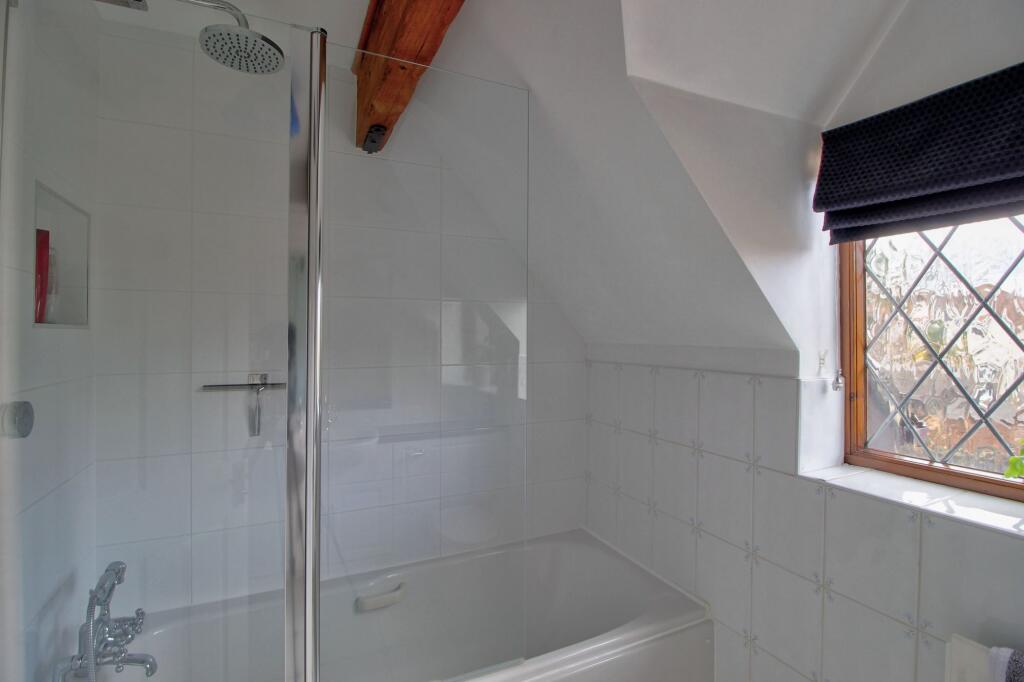 Bathtub with 'rainfall' shower