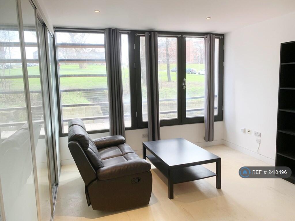 Living Room With Scenic Green Park Views