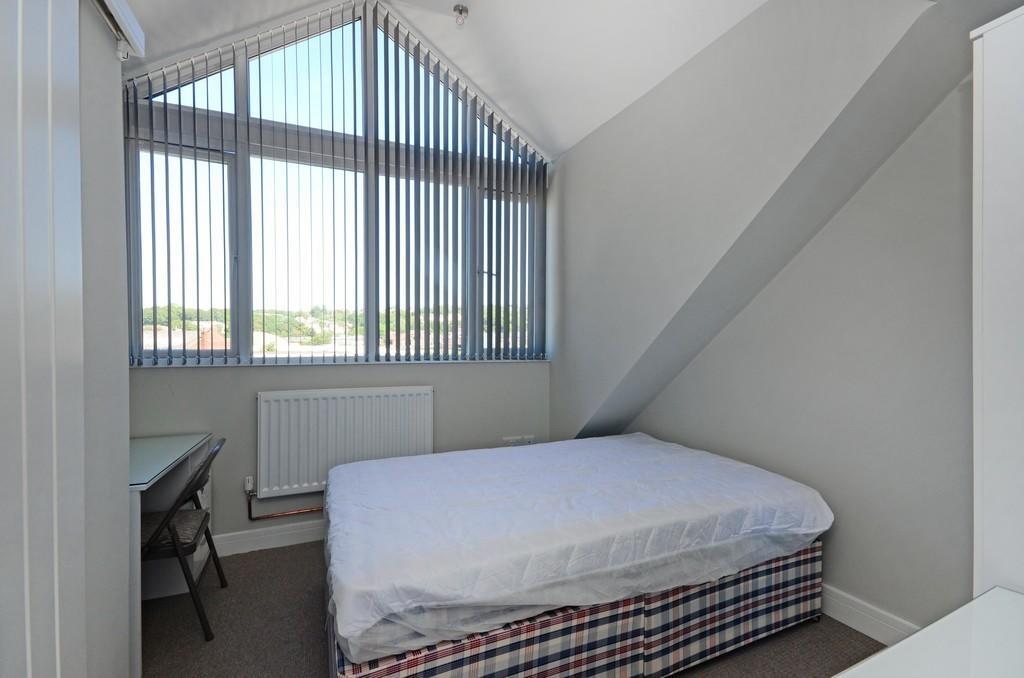 Bright and cozy double bedroom featuring a larg...
