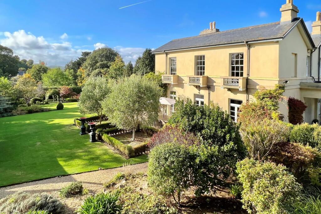 Driveway approach with a glimpse of grounds