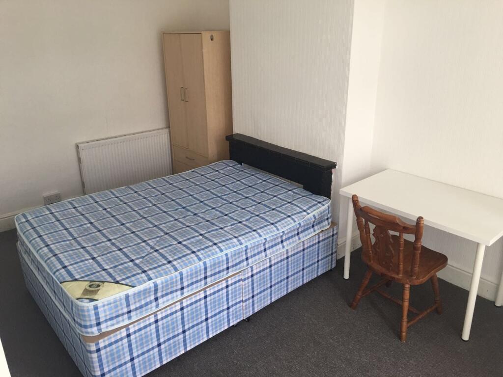 A spacious and inviting double bedroom, perfect...